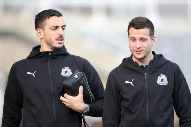 Joselu (right) with fellow Spaniard Javier Manquillo.