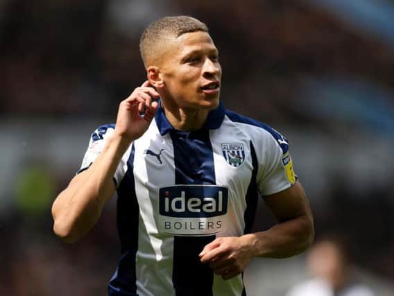 Newcastle striker Dwight Gayle celebrates scoring one of his 24 goals for West Brom last season (Getty).
