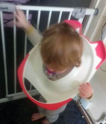 Clara-Mae Davey (2) with her head stuck in her potty trainer. Picture by family member.