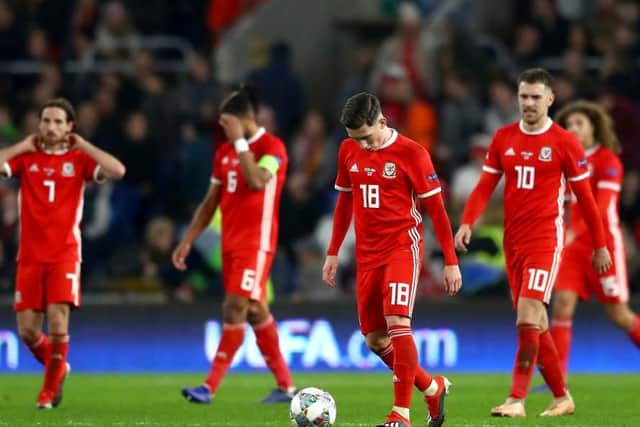 Harry Wilson of Wales looks dejected after Denmark score there second goal during the UEFA Nations League Group B match between Wales and Denmark at Cardiff City Stadium on November 16, 2018 in Cardiff, United Kingdom.  (Photo by Michael Steele/Getty Images)