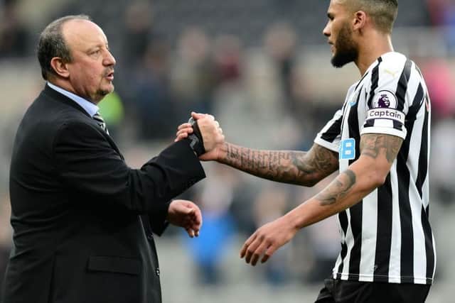 Jamaal Lascelles of Newcastle United (R) shakes hands with Rafael Benitez, Manager of Newcastle United following victory in the Premier League match between Newcastle United and Huddersfield Town at St. James Park on February 23, 2019 in Newcastle upon Tyne, United Kingdom.  (Photo by Mark Runnacles/Getty Images)