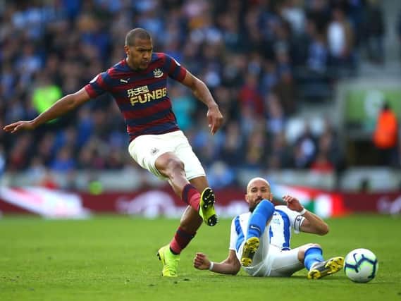 Salomon Rondon of Newcastle United is challenged by Bruno of Brighton and Hove Albion during the Premier League match between Brighton & Hove Albion and Newcastle United at American Express Community Stadium on April 27, 2019 in Brighton, United Kingdom. (Photo by Jordan Mansfield/Getty Images)