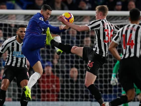 Chelsea's Belgian midfielder Eden Hazard (2nd L) vies with Newcastle United's English midfielder Sean Longstaff (2nd R) during the English Premier League football match between Chelsea and Newcastle United at Stamford Bridge in London on January 12, 2019.