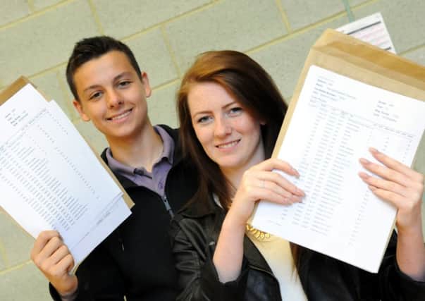 BIG DREAMS ... St Wilfrids RC College pupils Daniel Ford and Hannah Charman with their GCSE results