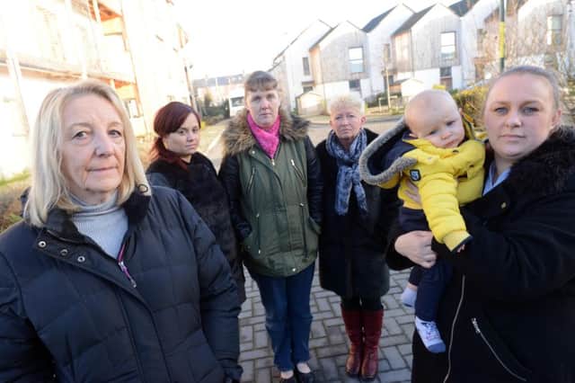 Sinclair Meadows residents are angry over eco estate are unhappy about the numerous times the  biomass boiler has broken down.
From left Vivien Bracey, Louise Bracey, Julie Douglas, Karen Smith and Rachel Marshall with one year old Lincoln Fail