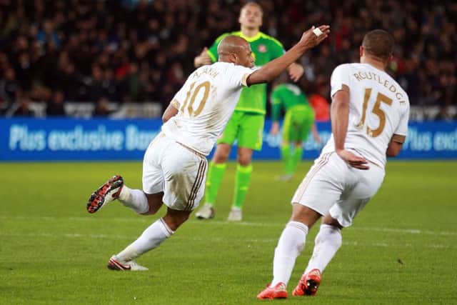 Andre Ayew wheels away after putting Swansea ahead