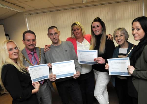 First Contact Clinical has presented its first peer mentors with certificates after they completed their mentoring programme. Pictured with them are Deputy Mayor and Mayoress Alan and Moira Smith.