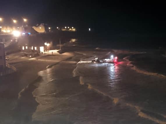 Emergency workers during the rescue operation at Cullercoats after a 15-year-old girl died after being swept into the sea by a big wave. Pic: Clare Guilding.