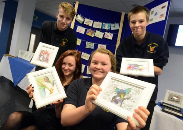 Mortimer Community College students are selling postcards and framed drawings to raise funds for the RSPB. 
From left, Ty Turnbull, Cerys Evans, Beth Millwater and Jonathan Russell