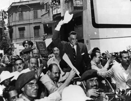 Egyptians celebrate after forces under President Nasser siezed and nationalised the Suez Canal.
