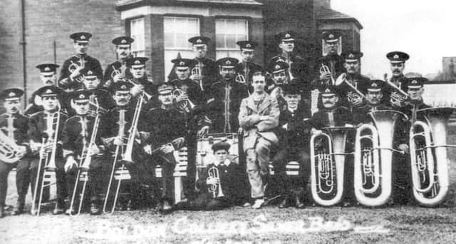 Shields Gazette Memory Lane   May 1914  
scanned from paper copy      Members of Boldon Colliery Silver Prize Band, pictured three years after its formation, in the garden of the colliery manager's house on 30 May 1914.  The bandmaster was Tom Pick and the little boy at the front was Ignatius Ford.  The building  behind the fence (right) was part of Cold Sides Farm.
