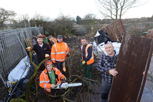 Since Ian Curry had his Holder House allotment broken into and hens stolen he has been receiving help from the community to clean up the space. 
From left, David Hind, Luke Towler,  Gary Stevens and Terry Hallam with Les Crabtree.