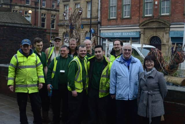 1 - Anne Corrigan, Project Coordinator for Big Local in Central Jarrow, and second right, Norman Graham, a Jarrow Big Local Board representative, and members of Groundworks Land Team with the dragonfly and snail artworks in background.