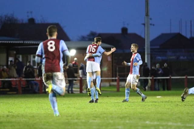 John Grey is congratulated after his debut goal for South Shields. Image by Peter Talbot.