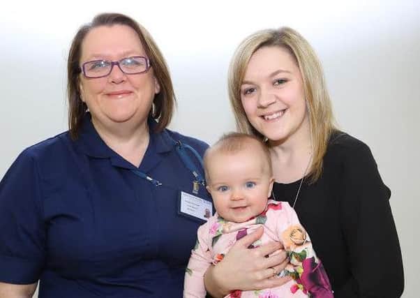 Midwife Gillian Coulthard with mum Samantha Murdoch and her daughter Emily Hope.