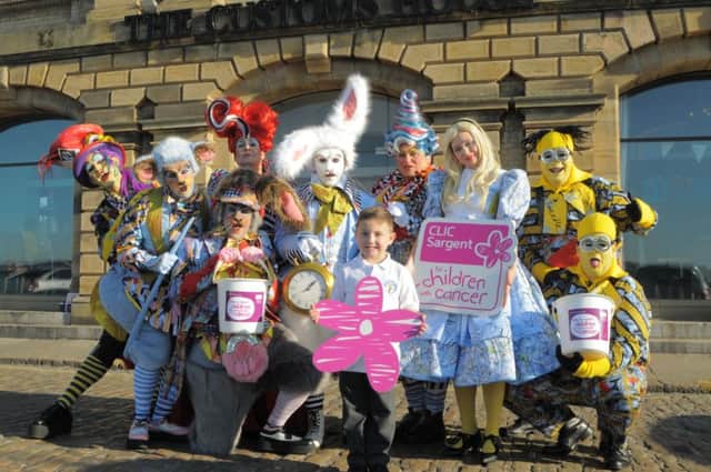 The cast of Alice in Wonderland with Harrison Cochrane, who was helped by CLIC Sargent.