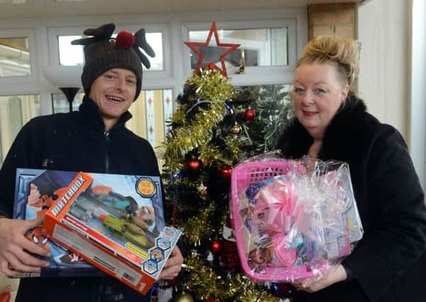 Toy Appeal at D and H Windows.
Glen Atkinson and Viv Watts