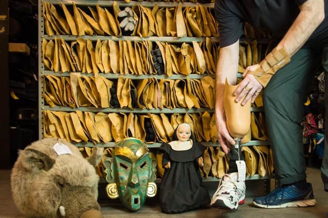 A soft toy boar's head, a carved wooden mask, a nun doll and a prosthetic leg are among the items at the Transport for London Lost Property Office.