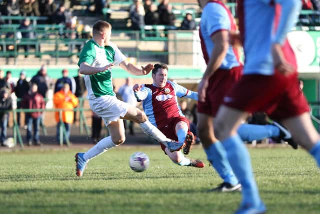 Warren Byrne sees an effort blocked for South Shields. Image by Peter Talbot.
