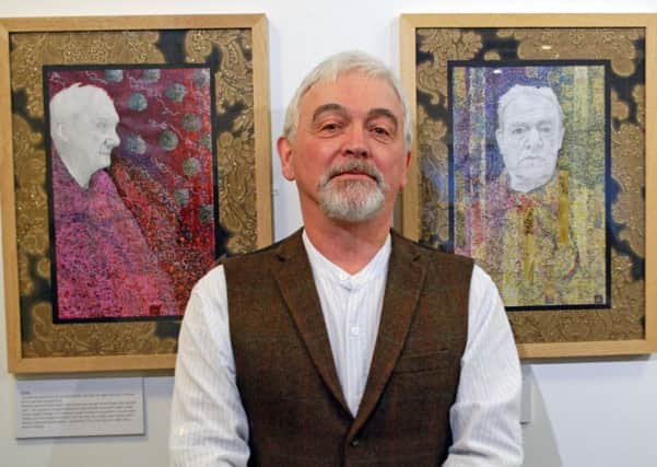Danny Gilchrist with two of his portraits. The one on the right is of his
dad, Dennis.