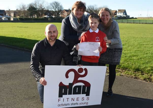 Mark Carter, from Play Fitness, Whitburn and Marsden councillor and Marsden Primary School governor Tracy Dixon, pupil Charlie Begg with his winning design and headteacher Caroline Marshall.