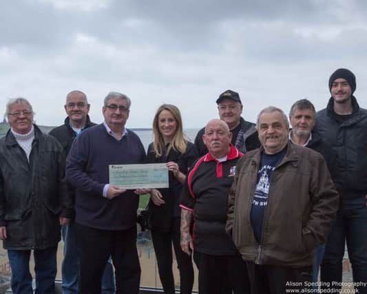 A cheque being presented to the North Shields Fisherman's Heritage Project from the Marine Managment Organisation.