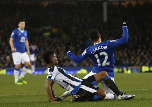 Newcastle United's Rolando Aarons brings down Everton's Aaron Lennon at Goodison Park