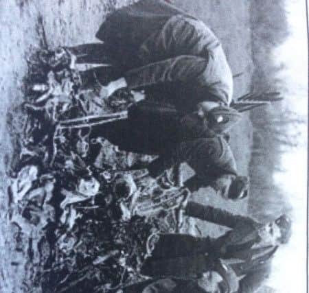 Examining the wreckage of the downed Heinkel bomber.
