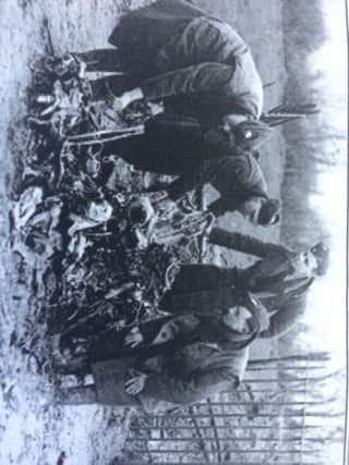 Examining the wreckage of the downed Heinkel bomber.