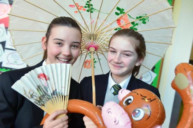 Chinese New Year celebrations at St Wilfrids RC College
From left Ellie Tomlin and Erin Craig