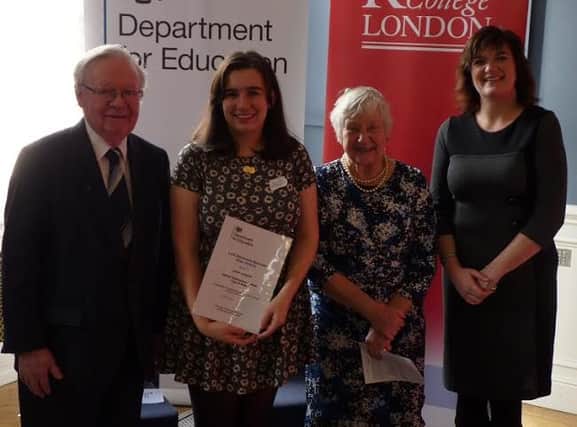 Leoni Loughlin is presented with Lord Glenamara Memorial Prize in recognition of her community work