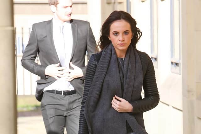 Stacey Flounders walking into court ahead of her partner, Adam Johnson, who is standing trial.