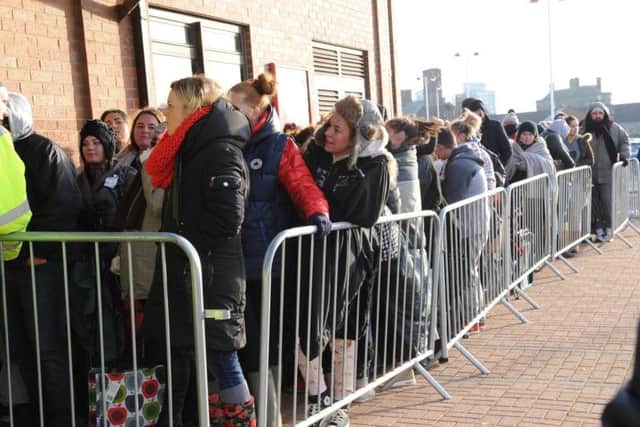 Fans line up outside the Stadium of Light's box office before tickets for Beyonc went on sale yesterday.