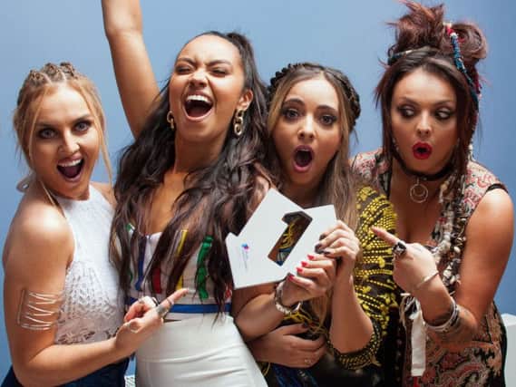 Little Mix celebrate Black Magic reaching No 1. Now the single has earned them two Brits nominations.