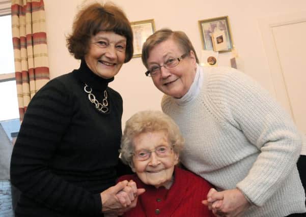Eleanor Cowey celebrates her 100th birthday in  December with daughters Marilyn McCoull, left, and Janice Nicholls.