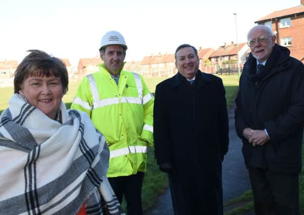 Councillors Tracey Dixon, Ed Malcolm and Allan West, with project manager Paul Quinn, at Farding Square.