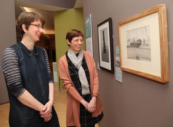 Valerie Hamill and Claire Stewart admiring the sketch at the unveiling.