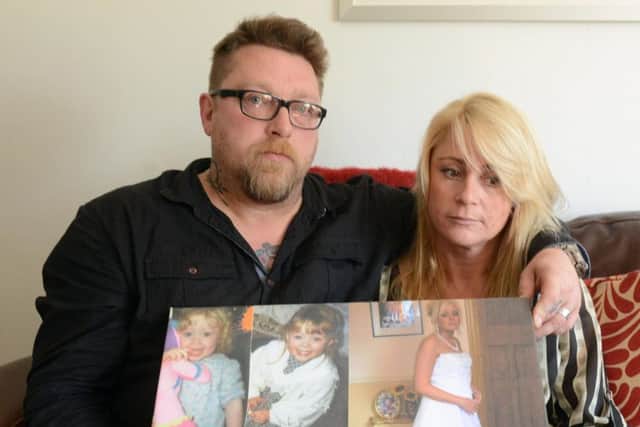 David and Tracey Keighley with pictures of Melissa.
