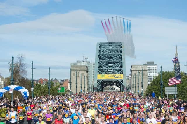 The Red Arrows are seen flying over the Tyne Bridge during the 2015 Morrisons Great North Run, Newcastle.