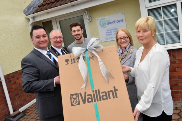 Vaillant Mark Meade donates a boiler to Cancer Connections Deborah Roberts. Mayor and mayoress Richard and Patricia Porthouse with patron paralympic Josef Craig MBE