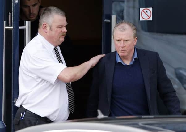 Steve McClaren gets a pat on the back as he leaves the training ground yesterday