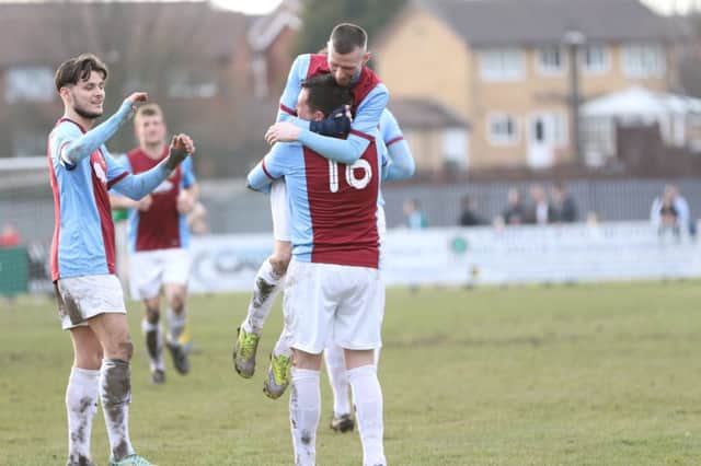 Barrie Smith mobs Warren Byrne after his second goal for South Shields against Esh Winning. Image by Peter Talbot.