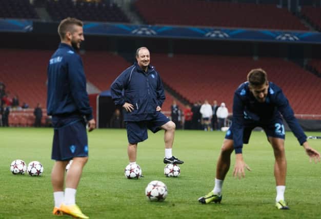 Rafa Benitez takes a training session while Napoli boss