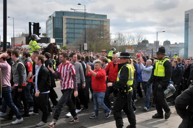 Sunderland fans escorted by police officers to St James Park.