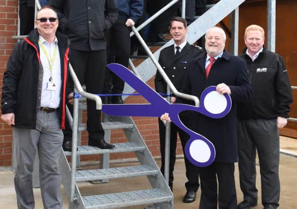 Kevin Slade, chairman of the Merchant Navy Training Board, officially opens the Marine and Offshore Safety Training Centres new building, watched by, from left, Jeremy Gough, head of marine simulation at South Shields Marine School; Shaun Makin, station manager with Tyne and Wear Fire and Rescue Service, and head of school Michael Speers.