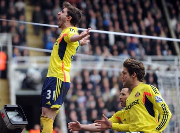 Fabio Borini celebrates scoring from the penalty spot at St James's Park