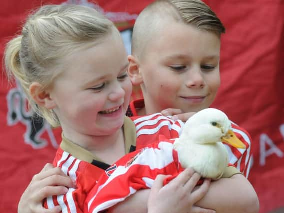 Mylie and Lincoln with Rosie the duck.