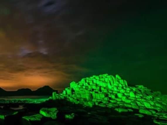The Giant's Causeway has been draped by a spectacular blanket of Green light as it gets ready to celebrate St Patricks Day. Picture: Matt Steele/McAuley Multimedia.