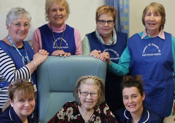 South Tyneside District Hospital Sisters Julie Woodhouse, left, and Sam Nicholson with patient Margaret Benjamin at one of the new tables and, left to right, Maureen Young, Jill Wilson, Sue Goddard and Mary Peterson, of The League of Friends.