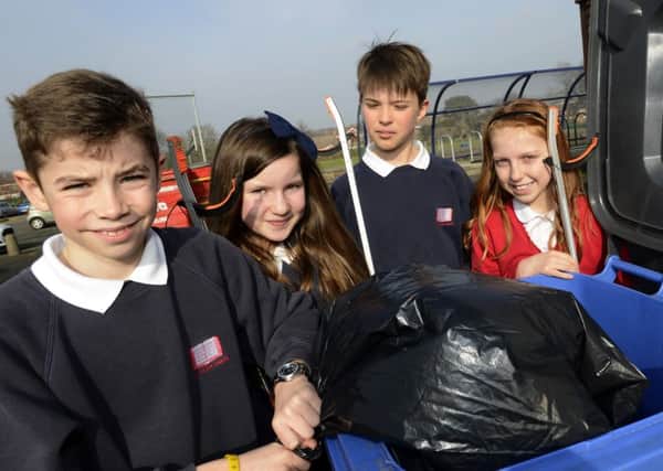 Litter pickers Alex O'Donnell, Charlotte Smith, Luke Elliott and Isobel Emery at East Boldon Junior School.